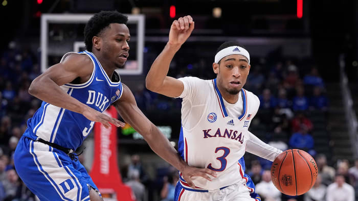 Kansas's Dajuan Harris Jr. drives vs. Duke